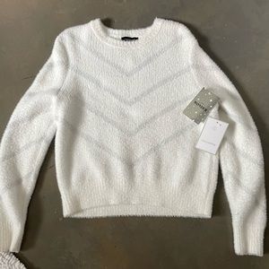 Calligraphie Sweater.  Tags still on never worn. Size large but runs small.